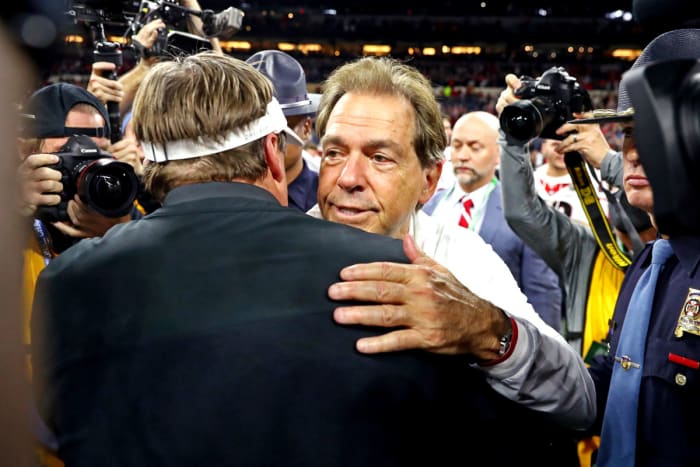 Jan 10, 2022; Indianapolis, IN, USA; Alabama Crimson Tide head coach Nick Saban and Georgia Bulldogs head coach Kirby Smart shake hands after the 2022 CFP college football national championship game at Lucas Oil Stadium. © Mark J. Rebilas-USA TODAY Sports